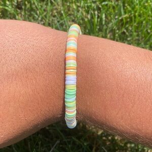 A handmade clay bead bracelet